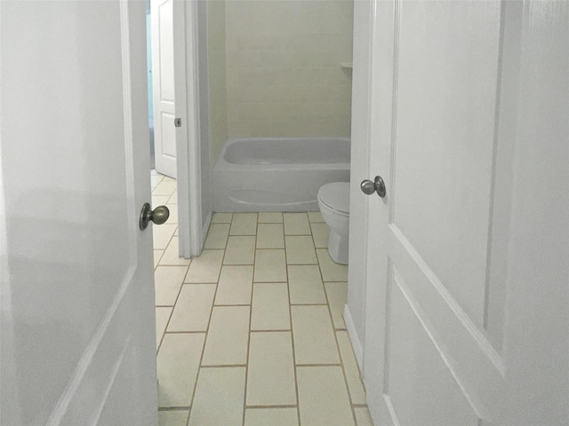 bathroom featuring tile patterned floors and toilet