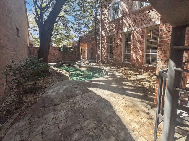 exterior space with a patio and a fenced backyard