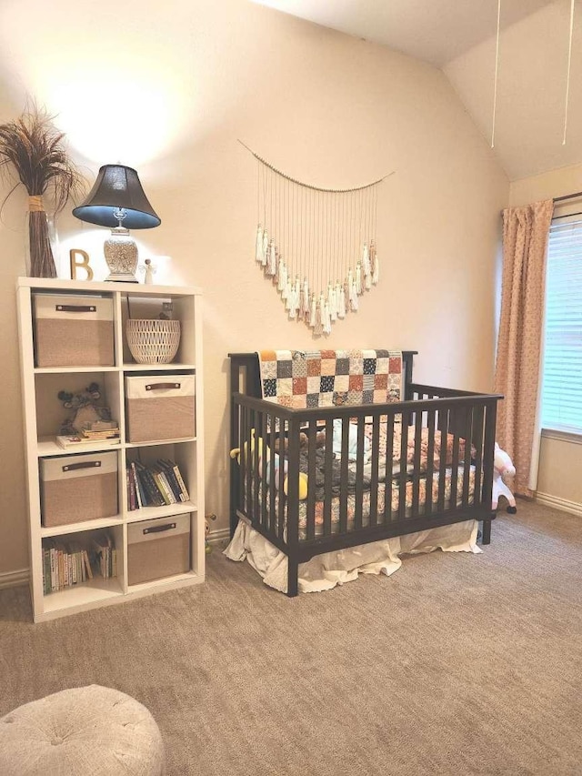 carpeted bedroom featuring lofted ceiling