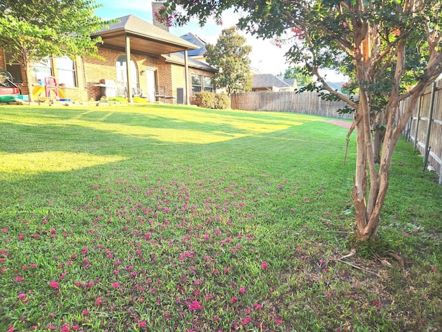 view of yard featuring a fenced backyard