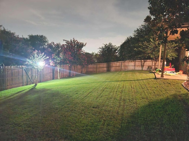 view of yard with a fenced backyard