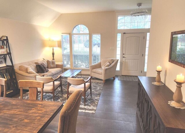 living room featuring lofted ceiling