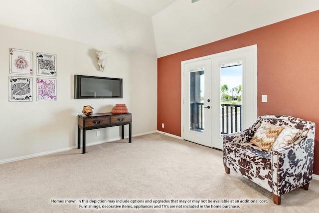 sitting room with carpet, lofted ceiling, french doors, and baseboards