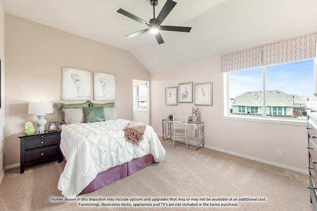 carpeted bedroom featuring lofted ceiling, a ceiling fan, and baseboards