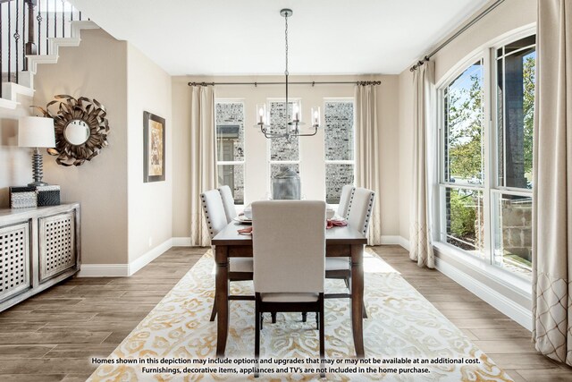 dining area featuring plenty of natural light, wood finished floors, and baseboards