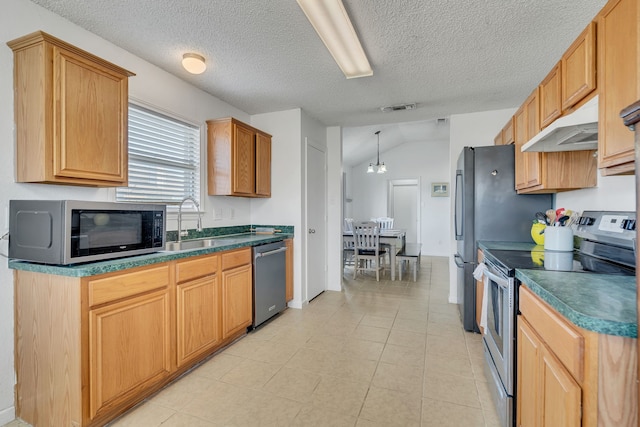 kitchen with under cabinet range hood, visible vents, dark countertops, and appliances with stainless steel finishes