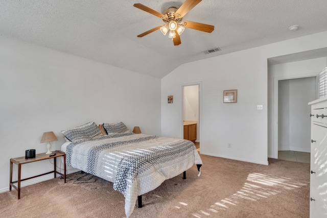 bedroom featuring visible vents, lofted ceiling, a textured ceiling, and carpet flooring