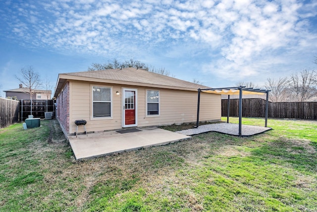 rear view of property with a lawn, a pergola, a patio, a fenced backyard, and central AC unit