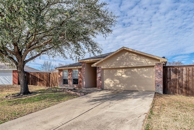 single story home with brick siding, an attached garage, driveway, and fence