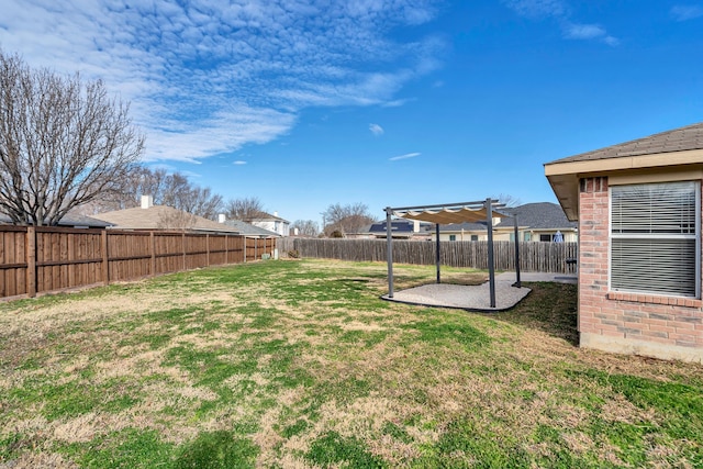 view of yard with a patio area, a fenced backyard, and a pergola