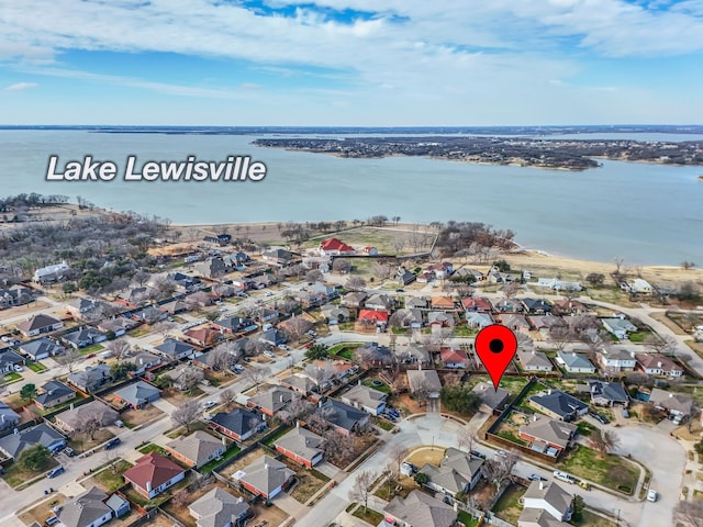 bird's eye view with a water view and a residential view