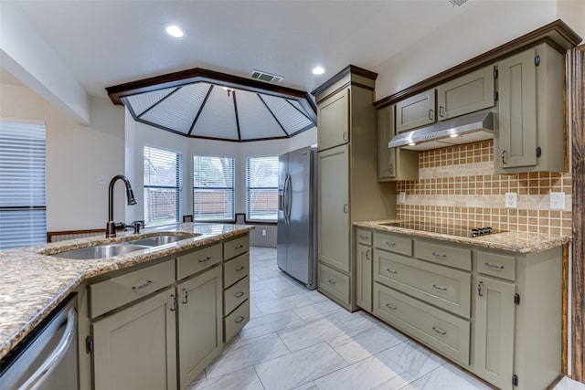 kitchen featuring visible vents, a sink, stainless steel appliances, under cabinet range hood, and tasteful backsplash