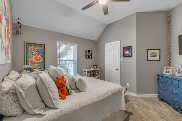 carpeted bedroom with vaulted ceiling, a ceiling fan, and baseboards