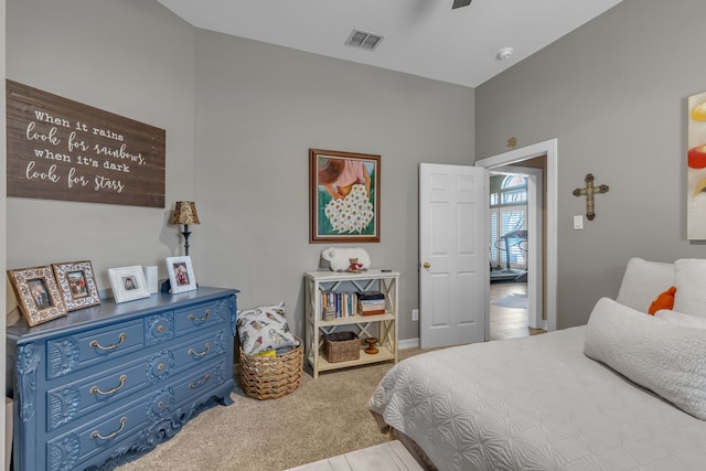 bedroom with visible vents, carpet floors, baseboards, and ceiling fan