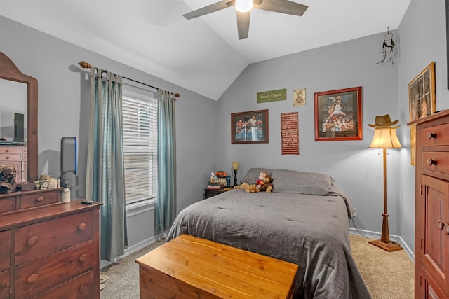 bedroom featuring light carpet, a ceiling fan, baseboards, and vaulted ceiling