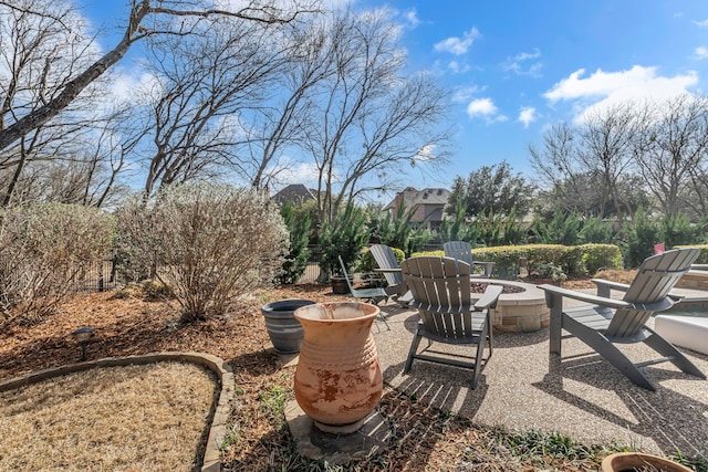 view of yard featuring a patio area and an outdoor fire pit