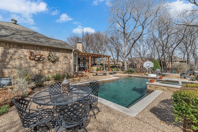 pool featuring a hot tub, a pergola, outdoor dining area, and a patio