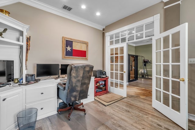 office with visible vents, light wood-style flooring, recessed lighting, french doors, and crown molding