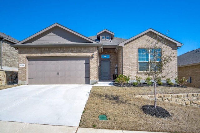 ranch-style house featuring brick siding, a garage, and driveway