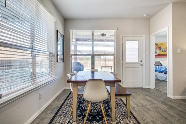 dining area featuring wood finished floors and baseboards