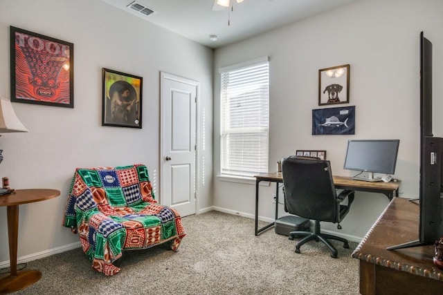 office featuring a ceiling fan, baseboards, visible vents, and carpet floors