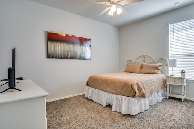 bedroom with light carpet and baseboards