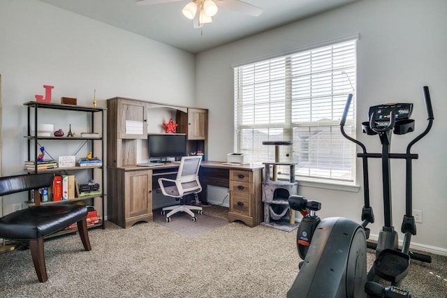 office with baseboards, light colored carpet, and a ceiling fan