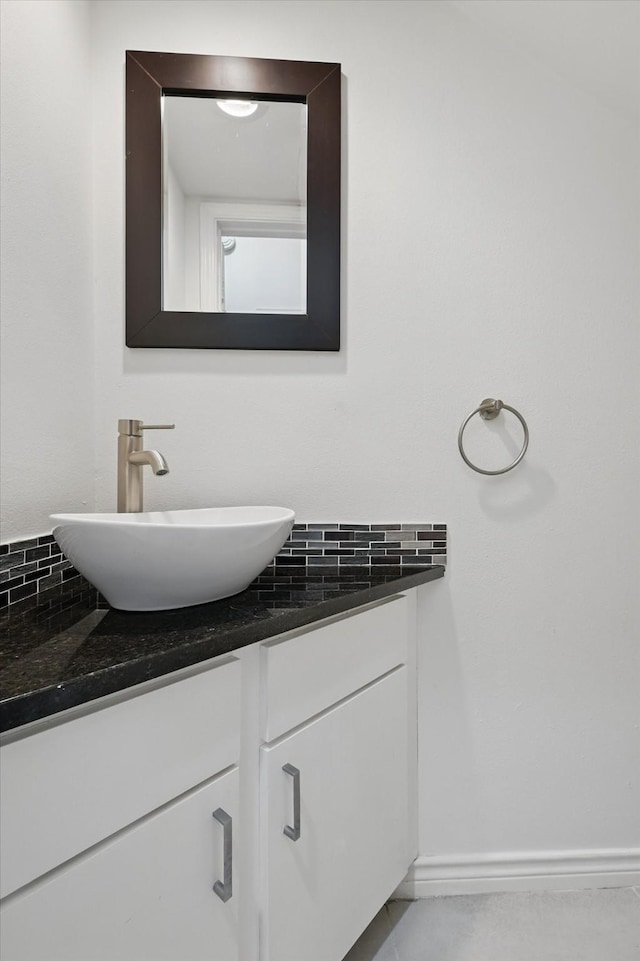 bathroom featuring vanity and baseboards