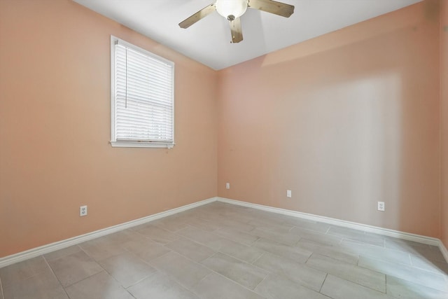 unfurnished room with baseboards and a ceiling fan