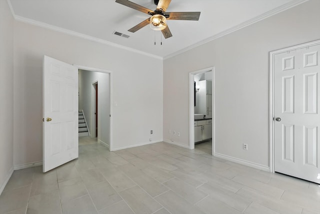 unfurnished bedroom featuring visible vents, ensuite bath, baseboards, and ornamental molding