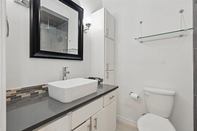 bathroom with toilet and vanity