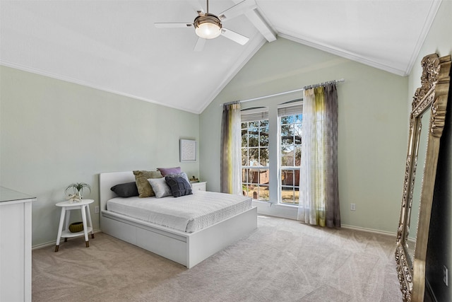 carpeted bedroom featuring baseboards, vaulted ceiling with beams, crown molding, and ceiling fan