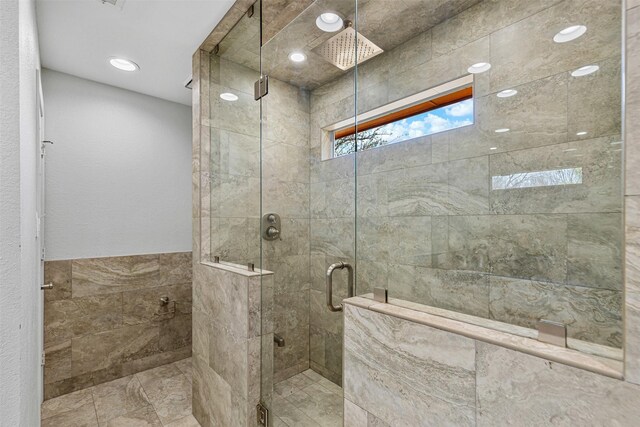 bathroom featuring a shower stall and recessed lighting