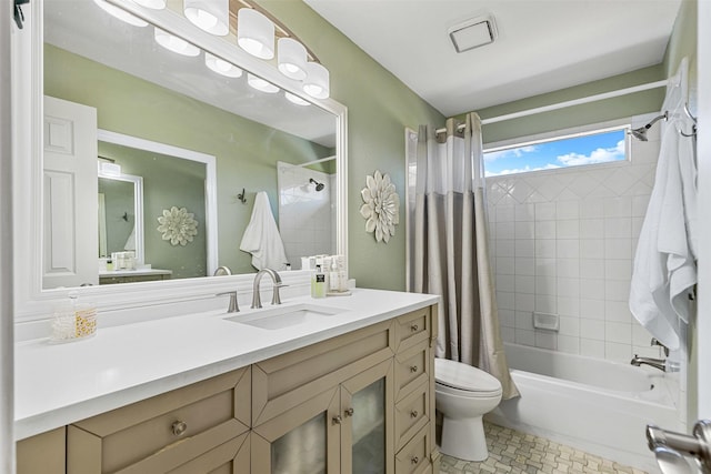 full bathroom with vanity, toilet, and shower / tub combo