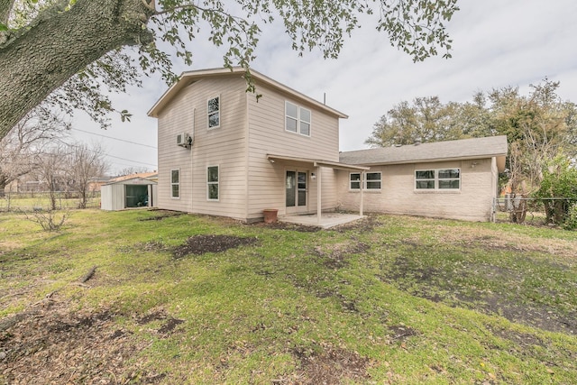 rear view of property featuring a yard, a patio area, and fence