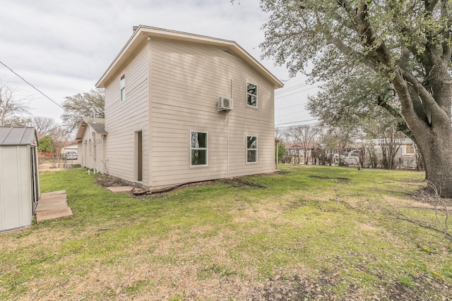 back of property with an outdoor structure, a wall unit AC, and a lawn