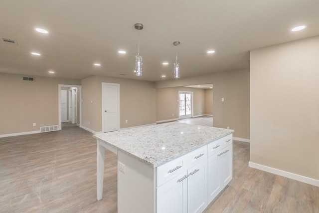 kitchen featuring recessed lighting, visible vents, open floor plan, and light wood-type flooring