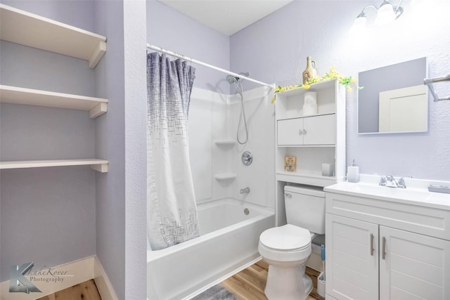 bathroom with shower / bath combo with shower curtain, toilet, wood finished floors, and vanity