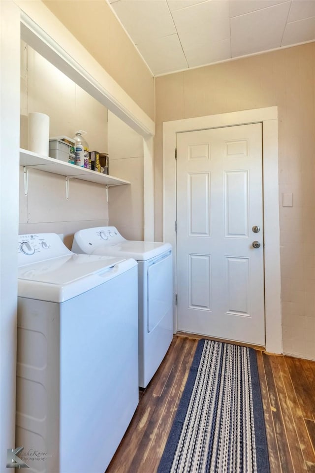 laundry room with laundry area, dark wood-style floors, and separate washer and dryer