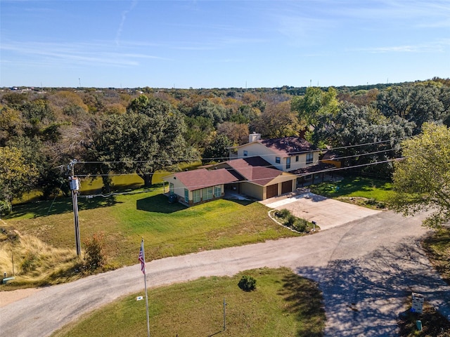 aerial view featuring a view of trees