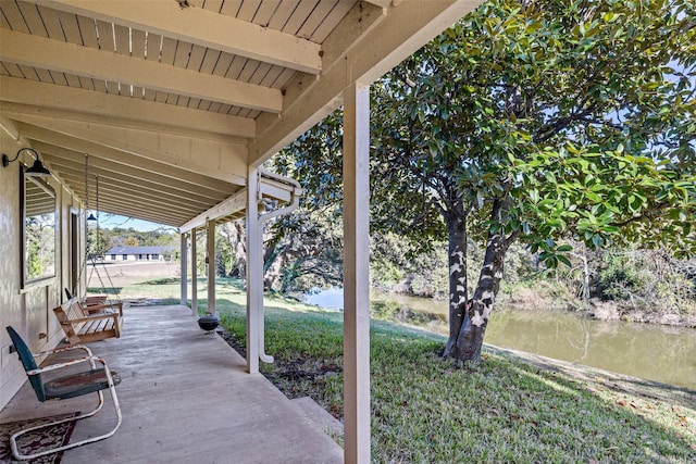 view of patio featuring a water view