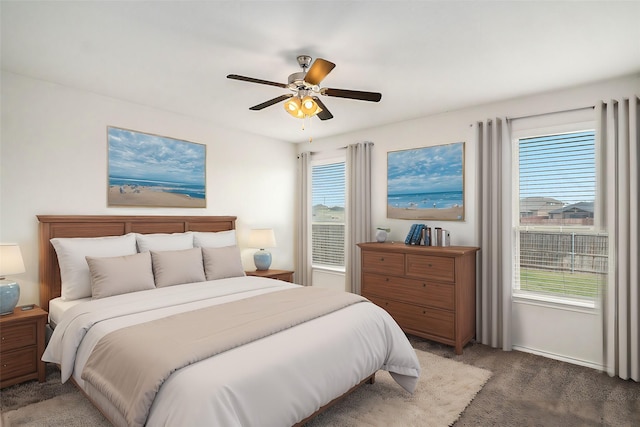 bedroom with ceiling fan and carpet floors