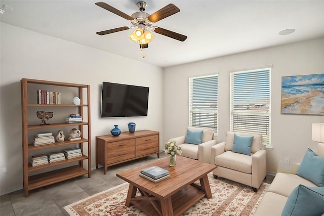 living area featuring ceiling fan