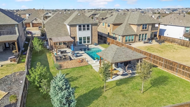 back of house with a patio area, a fenced backyard, and a residential view