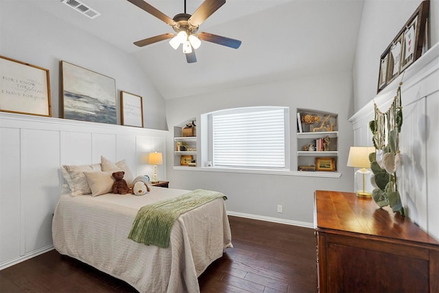 bedroom with baseboards, visible vents, dark wood finished floors, ceiling fan, and vaulted ceiling