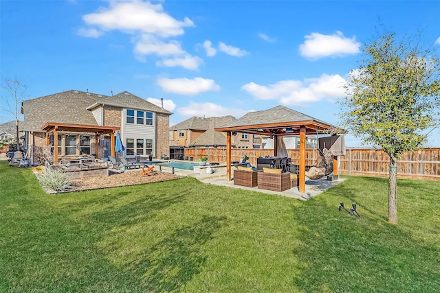 rear view of property featuring a gazebo, an outdoor living space, and a fenced backyard