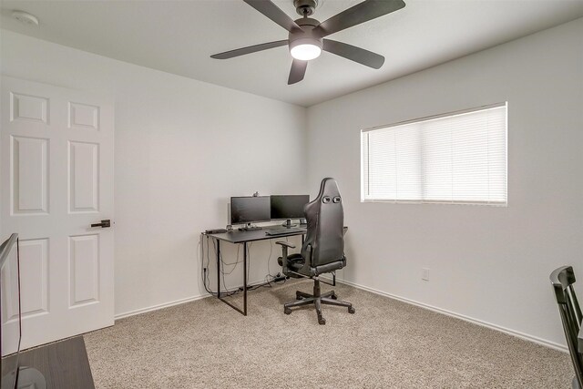 office with baseboards, carpet floors, and a ceiling fan