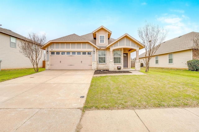 craftsman inspired home with a front yard, a shingled roof, concrete driveway, a garage, and stone siding