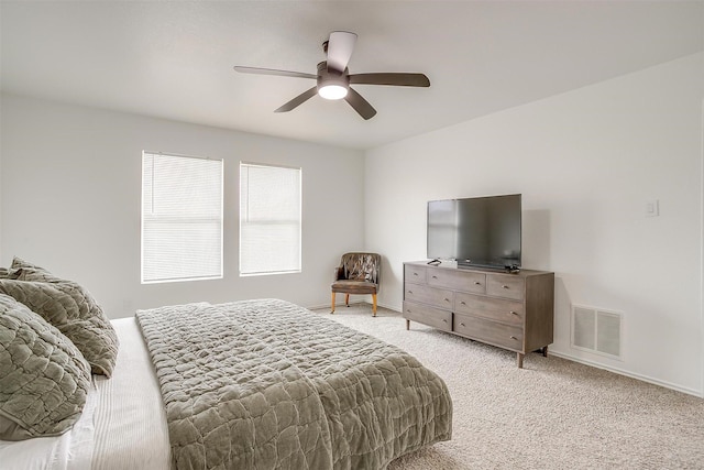 bedroom with light carpet, visible vents, ceiling fan, and baseboards