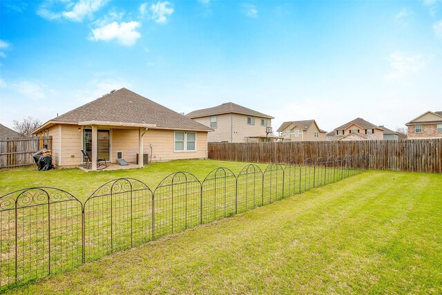 view of yard with a patio area and a fenced backyard